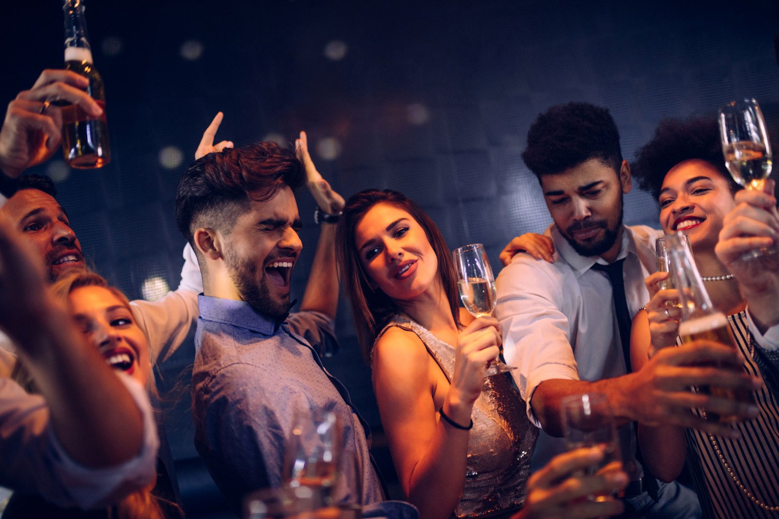 Couples drinking and dancing in  a party