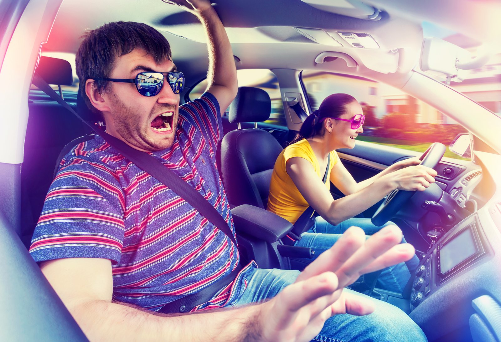 cool wife driving with panicked husband